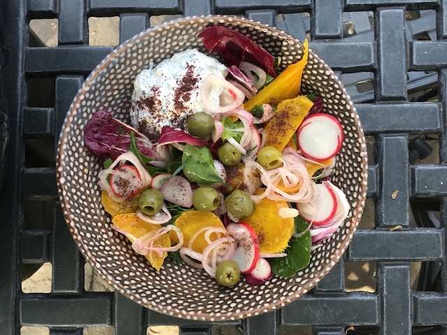 A daisy salad with yogurt, olives, and beets.