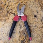 Pruning shears with friction tape wrapped around each handle.
